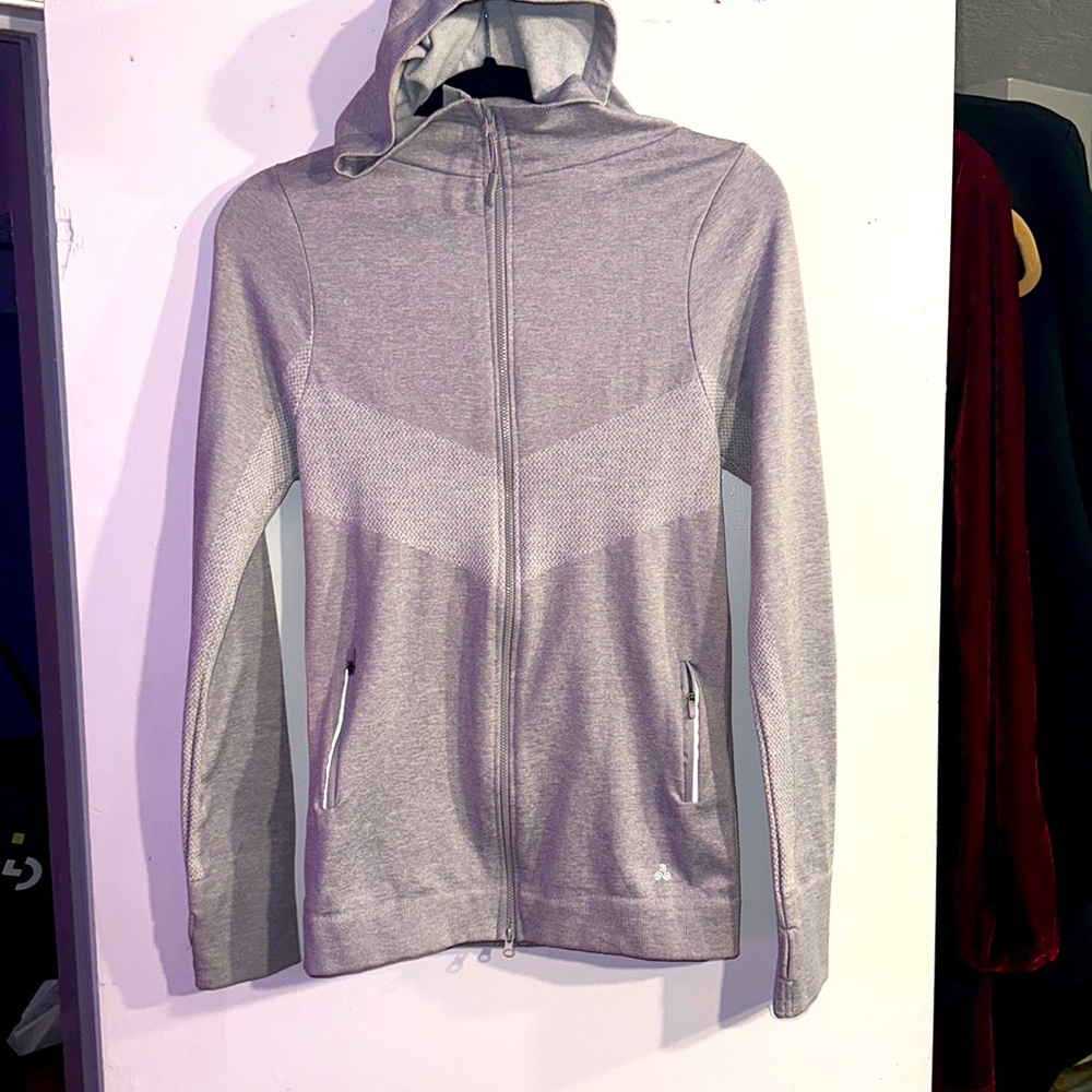 Near new, woman’s Solo Sport activewear thin zip up hoodie. In grey, size M